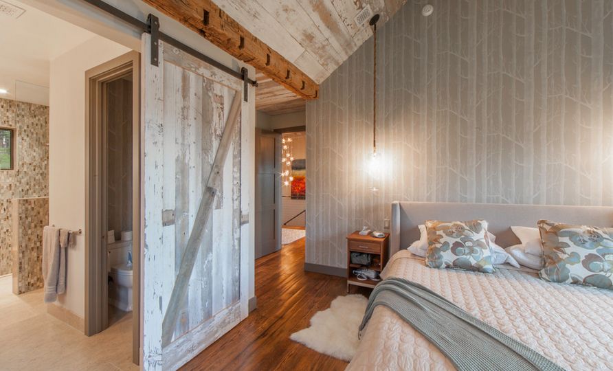 Bedroom sliding barn door and birch tree wallpaper