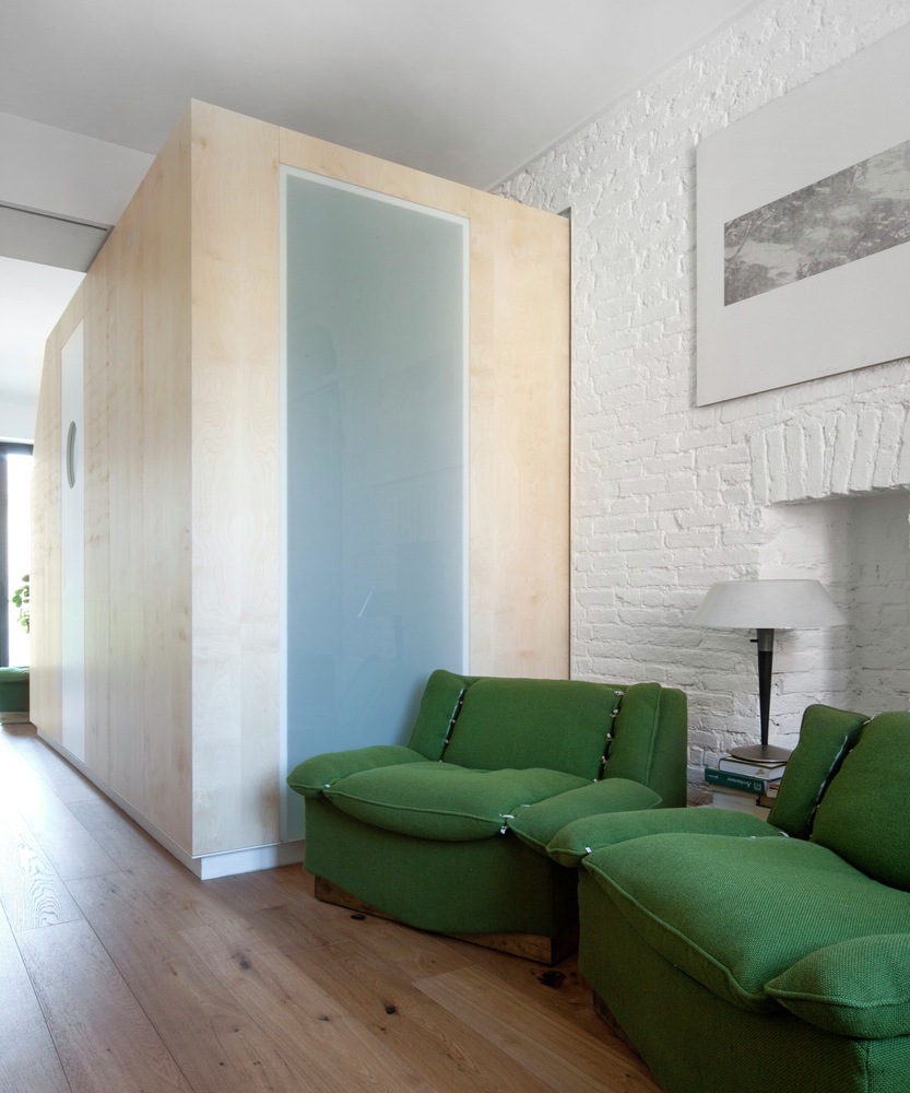 Turin apartment renovation green armchairs