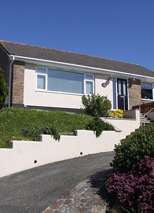 SALCOMBE DEVON: This two-bedroom bungalow is half a mile from the town centre, and near to the beach. It has planning permission  for a rear extension creating an extra bedroom and dining room. Marchand Petit (01548 844473, marchandpetit.co.uk) £385,000