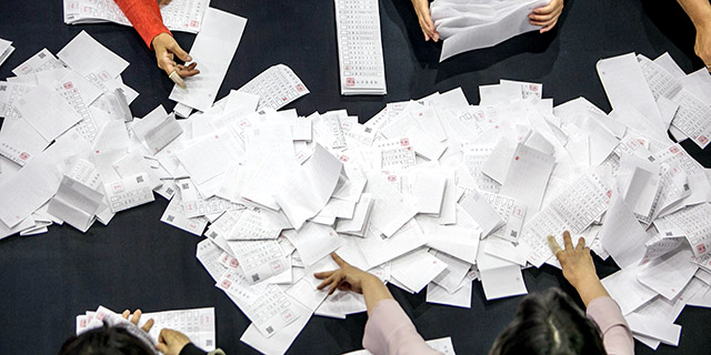 Tellers in Seoul, South Korea, count ballots from the May 2017 presidential election, which had a turnout of nearly 78% of the voting-age population. (Jean Chung/Getty Images)