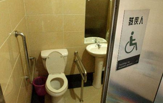 A wheelchair-accessible public toilet facility
